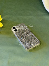 iPhone 17 phone case in silver plated brass featuring detailed traditional carvings