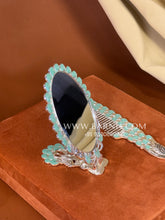 Decorative silver handheld mirror and matching comb for everyday use and bridal trousseau