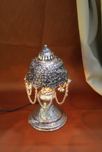 Vintage-inspired decorative lamp with detailed carvings, ideal for festive décor and gifting.