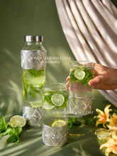 detox water served in silver plated bottle and glasses for luxury hosting