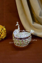 Handcrafted peacock-shaped sugar pot with enamel feather detailing, elegant silver jar symbolizing prosperity, ideal for weddings and housewarmings.