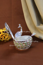 Handcrafted peacock-shaped sugar pot with enamel feather detailing, elegant silver jar symbolizing prosperity, ideal for weddings and housewarmings.