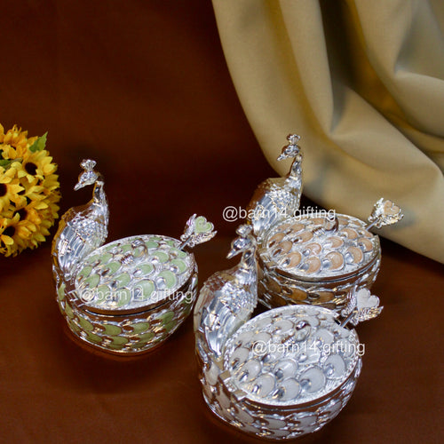 Handcrafted peacock-shaped sugar pot with enamel feather detailing, elegant silver jar symbolizing prosperity, ideal for weddings and housewarmings.