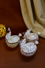 Handcrafted peacock-shaped sugar pot with enamel feather detailing, elegant silver jar symbolizing prosperity, ideal for weddings and housewarmings.