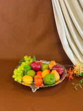 Decorative silver thaal with flower design for fruit serving