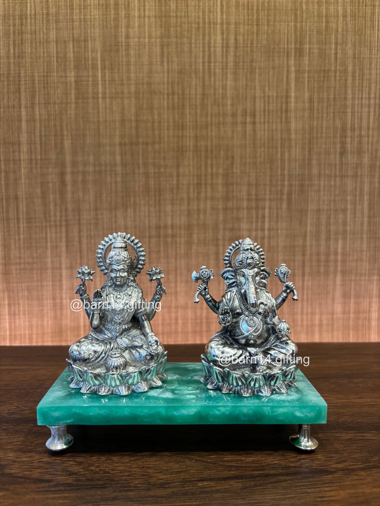 Beautifully handcrafted Ganesh and Lakshmi statue duo seated on a green base, representing divine blessings of wealth and knowledge — ideal for festive worship. auspicious gifting, Diwali gifting, housewarmings, and pooja décor.