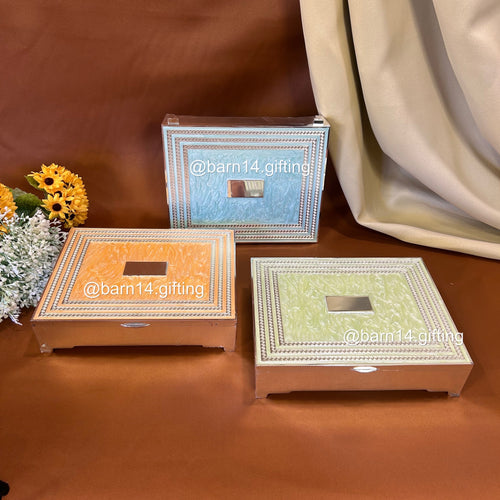 Silver-plated glitter dry fruit box with elegant textured design, ideal for festive gifting, weddings, and Diwali celebrations. Perfect for serving sweets and dry fruits in style.