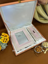 Elegant glitter-finish dry fruit box and photo frame gift set, perfect for Diwali, weddings, and festive gifting. Silver-plated detailing adds luxury and sparkle to celebrations
