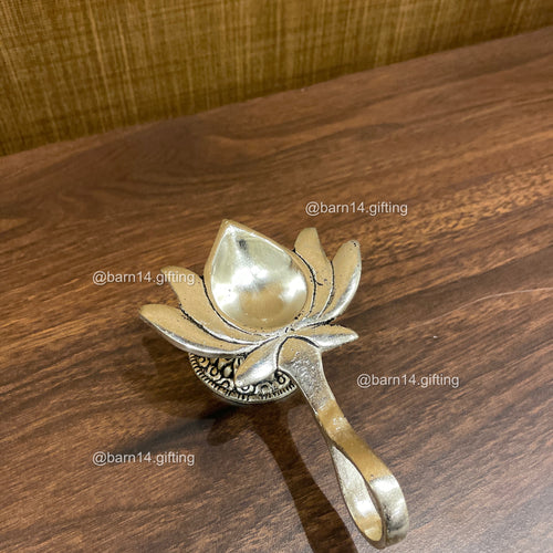 Lotus Aarti Diya in German Silver – traditional lotus-shaped diya for pooja, aarti, Diwali décor, and auspicious gifting.