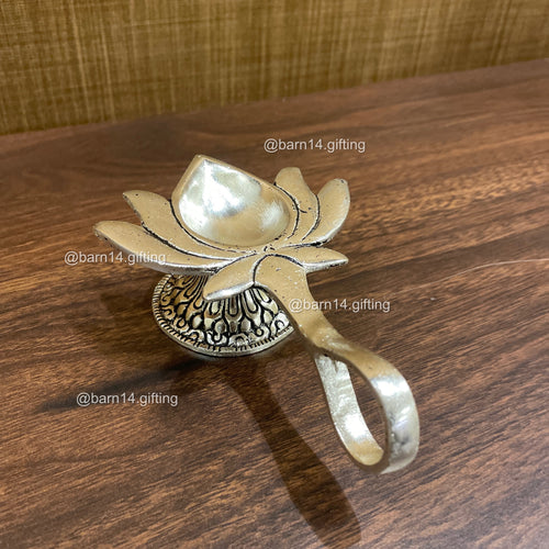 Lotus Aarti Diya in German Silver – traditional lotus-shaped diya for pooja, aarti, Diwali décor, and auspicious gifting.
