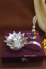 Handcrafted lotus diya with matching pink stone bell, sacred symbols of purity and devotion, perfect for festive hampers and pooja décor.