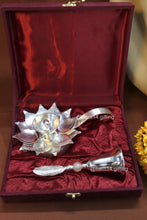 Handcrafted lotus diya with matching pink stone bell, sacred symbols of purity and devotion, perfect for festive hampers and pooja décor.