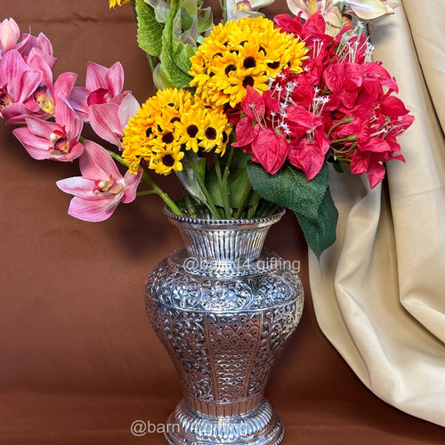 Decorative silver vase with traditional embossed detailing, adding a royal touch to interiors and floral arrangements for living rooms, consoles, and festive or wedding gifting.