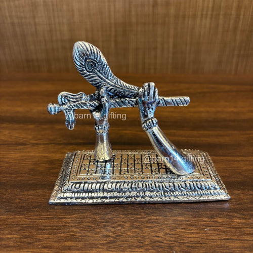 German silver Krishna flute idol with peacock feather – Mohan Basuri stand for spiritual décor and auspicious gifting.