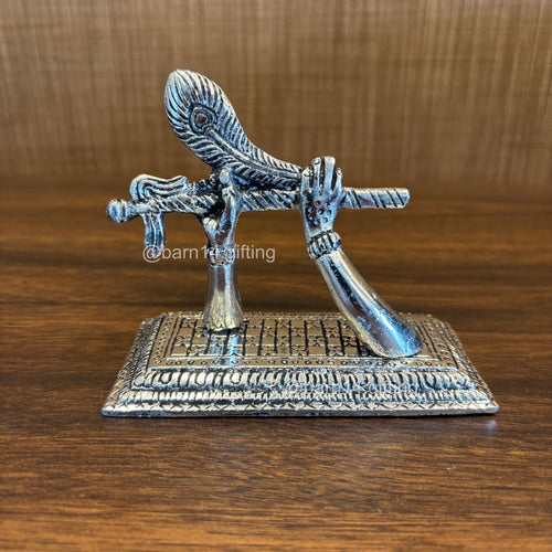 German silver Krishna flute idol with peacock feather – Mohan Basuri stand for spiritual décor and auspicious gifting.