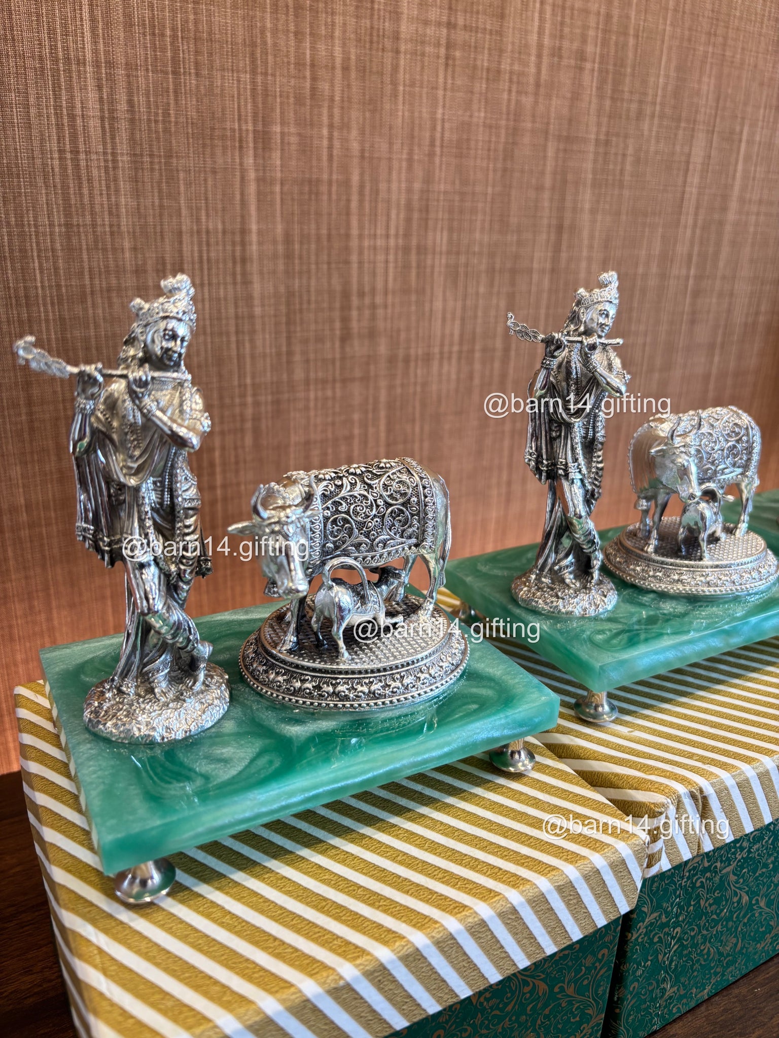 Handcrafted Krishna idol playing flute with cow, set on vibrant green base, radiating love and blessings, ideal for festive, spiritual, and traditional gifting.
