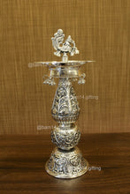 traditional diya stand with intricate peacock design and hanging ghungroos, elegant diya holder for temples, weddings, Diwali décor, and auspicious gifting.