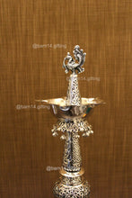 Handcrafted silver finish peacock diya stand – auspicious deepam for festivals, housewarming gifts, and spiritual ceremonies.