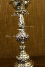 Handcrafted silver finish peacock diya stand – auspicious deepam for festivals, housewarming gifts, and spiritual ceremonies.