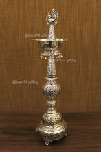 Handcrafted silver finish peacock diya stand – auspicious deepam for festivals, housewarming gifts, and spiritual ceremonies.
