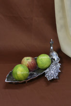 Handcrafted peacock leaf tray with feather detailing, elegant silver centerpiece for weddings, housewarmings, and home décor.