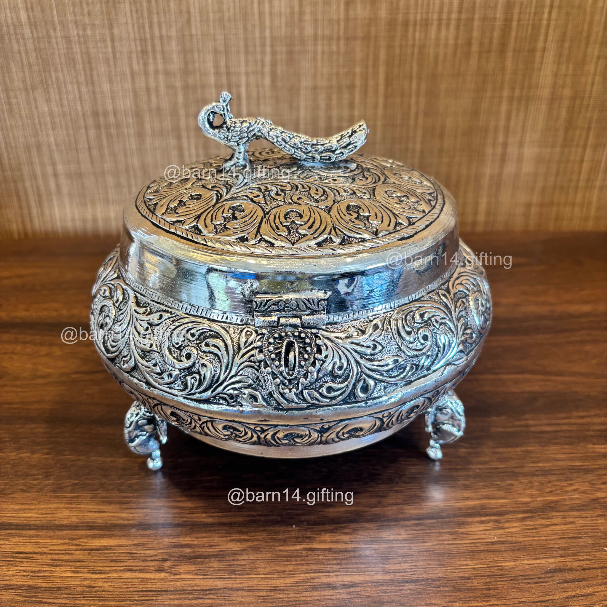 Elegant silver dry fruit box with detailed peacock motif, premium centerpiece and wedding gift for Diwali, anniversaries, and festive occasions.