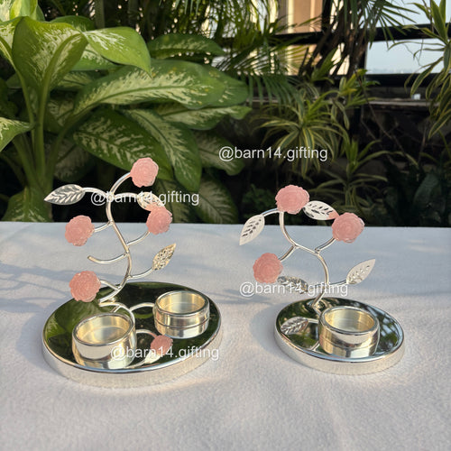 Silver-plated pink rose T-light holder with delicate stone flowers, elegant home décor and festive gifting choice for Diwali, weddings, and housewarmings.