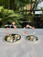 Silver-plated pink rose T-light holder with delicate stone flowers, elegant home décor and festive gifting choice for Diwali, weddings, and housewarmings.