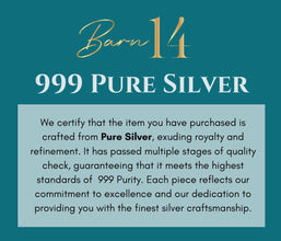Text certifying 999 pure silver with decorative elements on a teal background