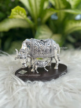 Elegant silver cow and calf figurine mounted on polished wooden base, premium gift for corporate, traditional, and religious occasions.