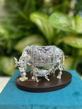Elegant silver cow and calf figurine mounted on polished wooden base, premium gift for corporate, traditional, and religious occasions.
