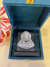 Handcrafted pure silver Khatu Shyam Ji murti on display stand, symbol of faith and divine grace, perfect for daily worship.