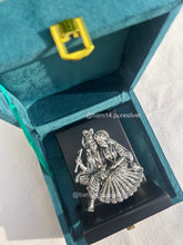 999 pure silver Radha Krishna idol on stand, handcrafted devotional gift symbolizing eternal love and harmony, ideal for weddings, anniversaries, and housewarmings.