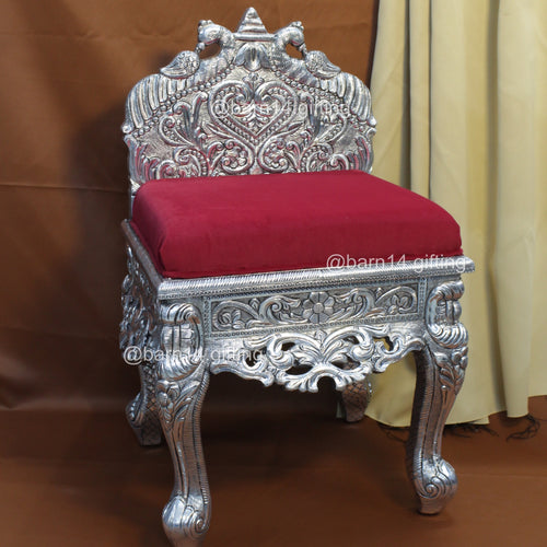 Elegant silver carved chair with intricate detailing and velvet seat, perfect for weddings, gatherings, and royal interiors.