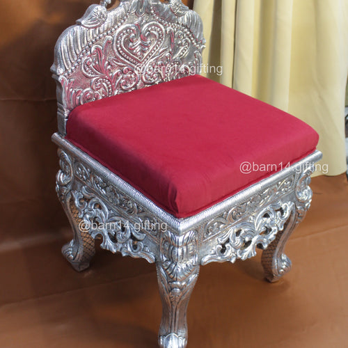 Elegant silver carved chair with intricate detailing and velvet seat, perfect for weddings, gatherings, and royal interiors.