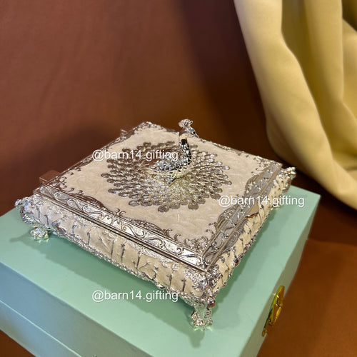 Premium enamel dry fruit box with ornate silver finish and peacock top, luxurious centerpiece and memorable gift for Diwali, weddings, anniversaries, and corporate celebrations.
