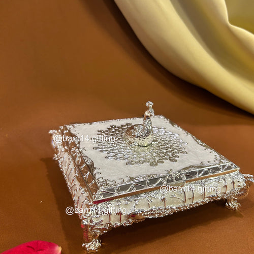 Premium enamel dry fruit box with ornate silver finish and peacock top, luxurious centerpiece and memorable gift for Diwali, weddings, anniversaries, and corporate celebrations.