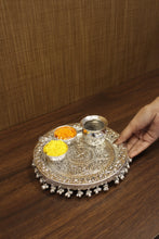 Sacred Swastik design pooja thali set in silver finish, complete with katoris and lota, symbol of purity and devotion for prayers, festivals and religious occasions