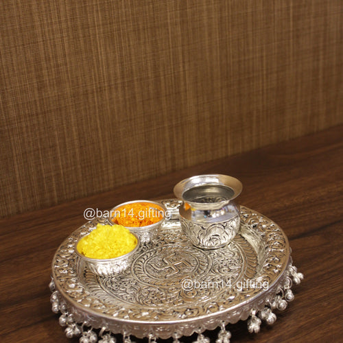 Sacred Swastik design pooja thali set in silver finish, complete with katoris and lota symbol of purity and devotion for prayers, festivals and religious occasions