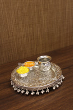 Sacred Swastik design pooja thali set in silver finish, complete with katoris and lota symbol of purity and devotion for prayers, festivals and religious occasions