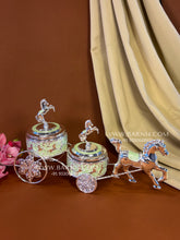 Decorative enamel horse carriage box with intricate detailing.