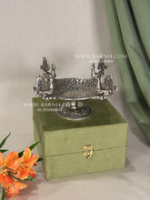 Decorative peacock platter with engraved detailing.