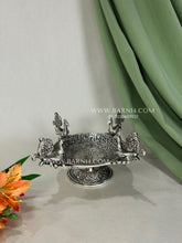 German silver peacock platter as a table centrepiece.