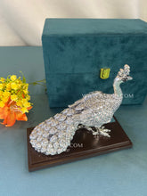Handcrafted 999 Pure Silver Peacock Statue on wooden display base.