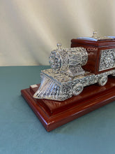 Luxury tea and coffee station organizer in the shape of a silver train.
