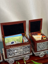 Premium silver train organizer with multiple compartments for elegant serving.