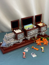 Handcrafted silver train centerpiece for luxury gifting and home décor.