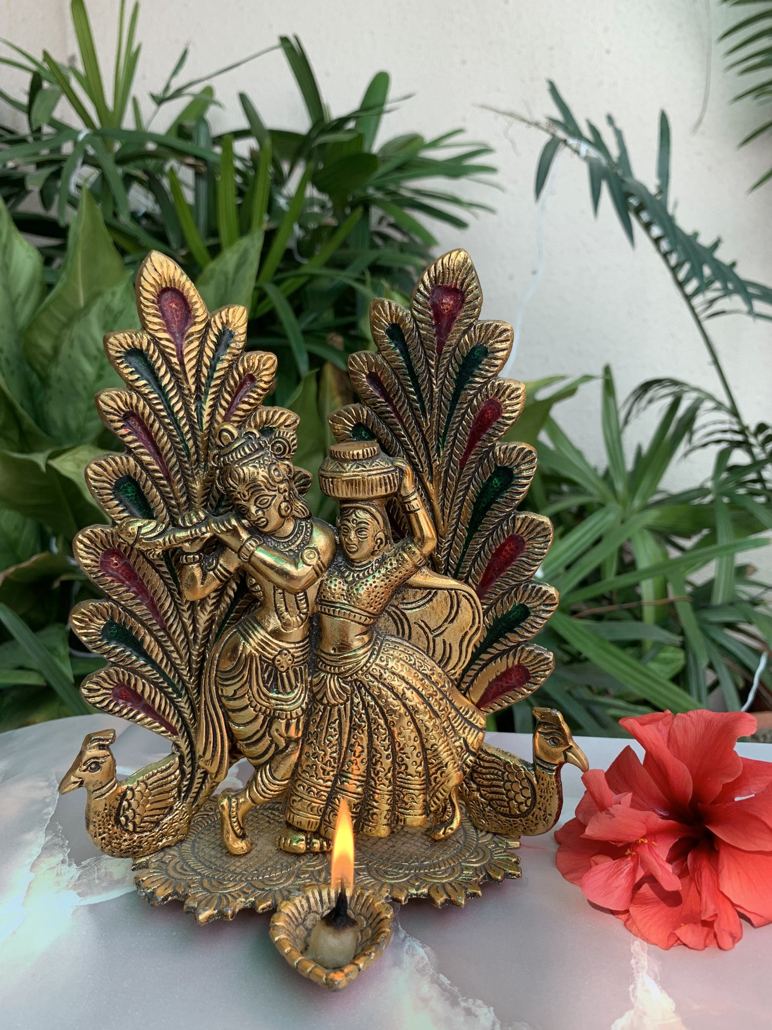 The Radha Krishna Idol is a chic, handmade statue that celebrates love and togetherness. If you're looking for the perfect gift for your loved one, this is it. This Radha Krishna idol is a manifestation of love and happiness. In Hinduism, the divine couple is worshipped and glimpsing the statue is said to bring one joy. This idol is beautifully handcrafted with gold finish.. 