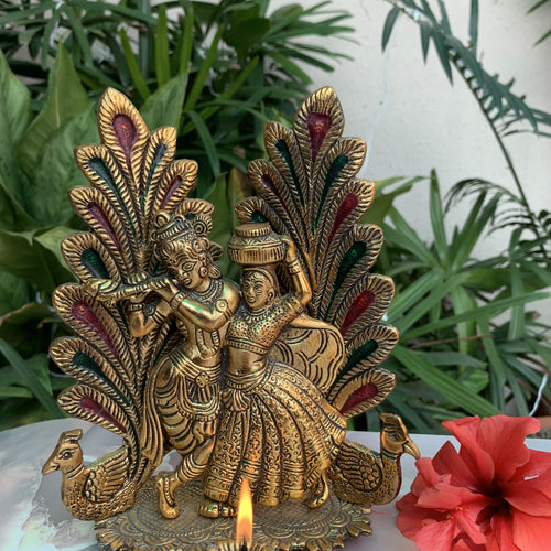 The Radha Krishna Idol is a chic, handmade statue that celebrates love and togetherness. If you're looking for the perfect gift for your loved one, this is it. This Radha Krishna idol is a manifestation of love and happiness. In Hinduism, the divine couple is worshipped and glimpsing the statue is said to bring one joy. This idol is beautifully handcrafted with gold finish.. 